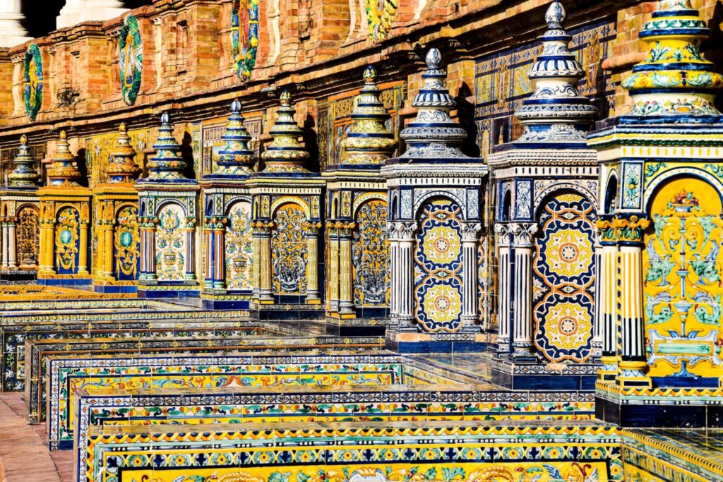 A vibrant display of ornate ceramic tiles at Plaza de España in Seville, showcasing traditional Spanish craftsmanship.